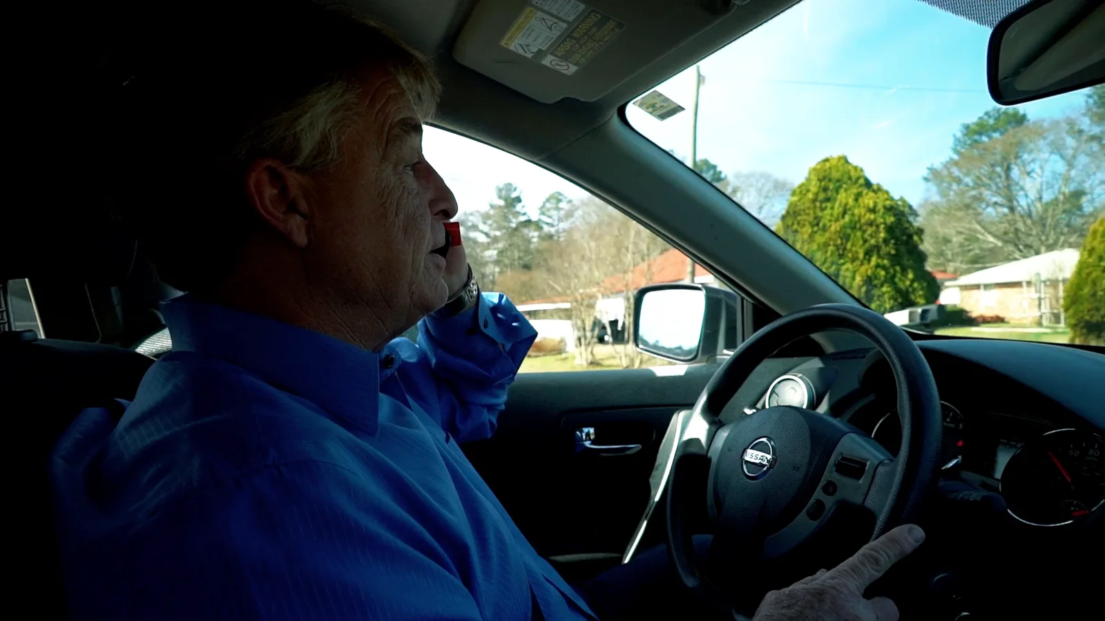 Greg Langford driving, sunlight through the window