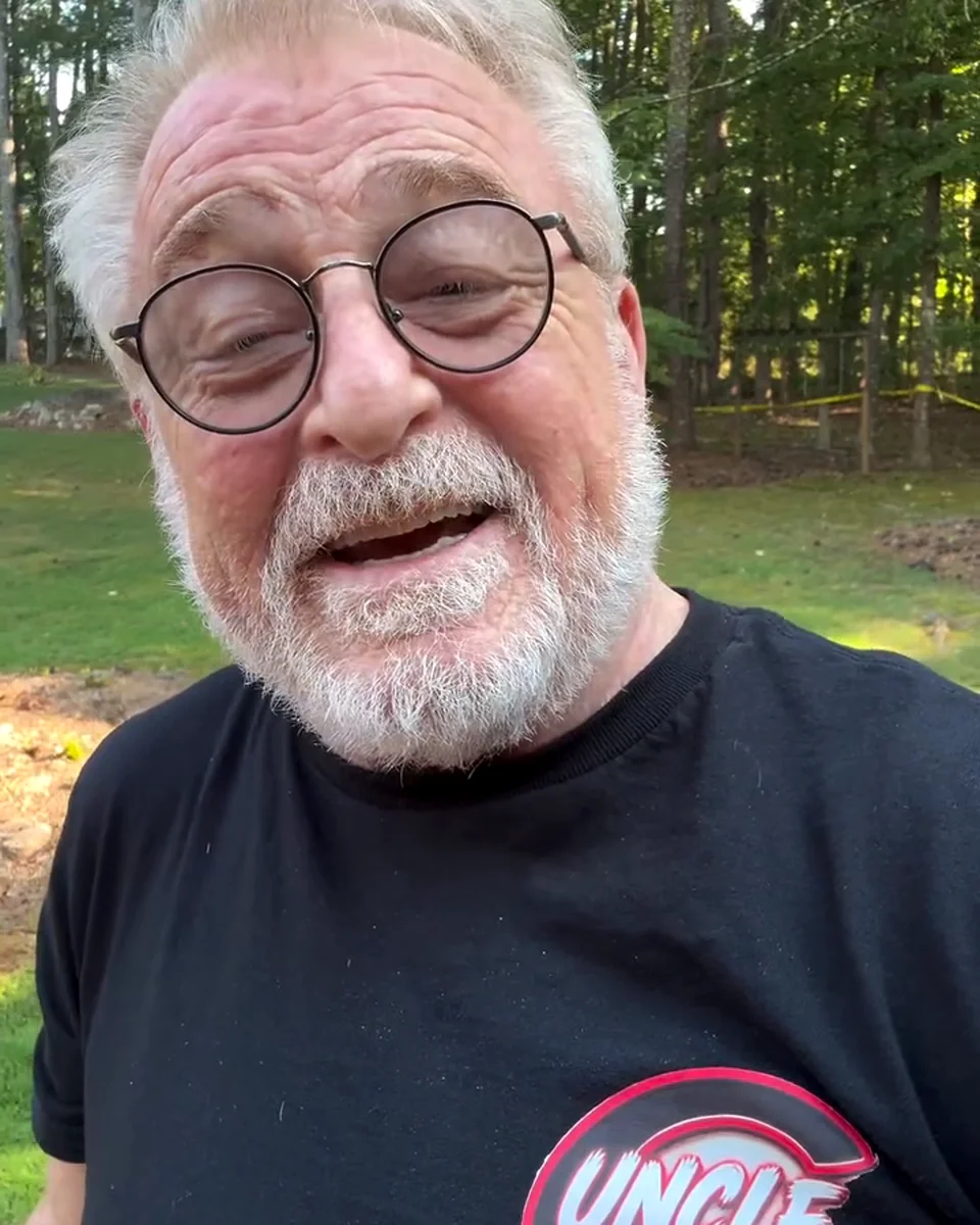Uncle G outdoors in his UNCLE G t-shirt